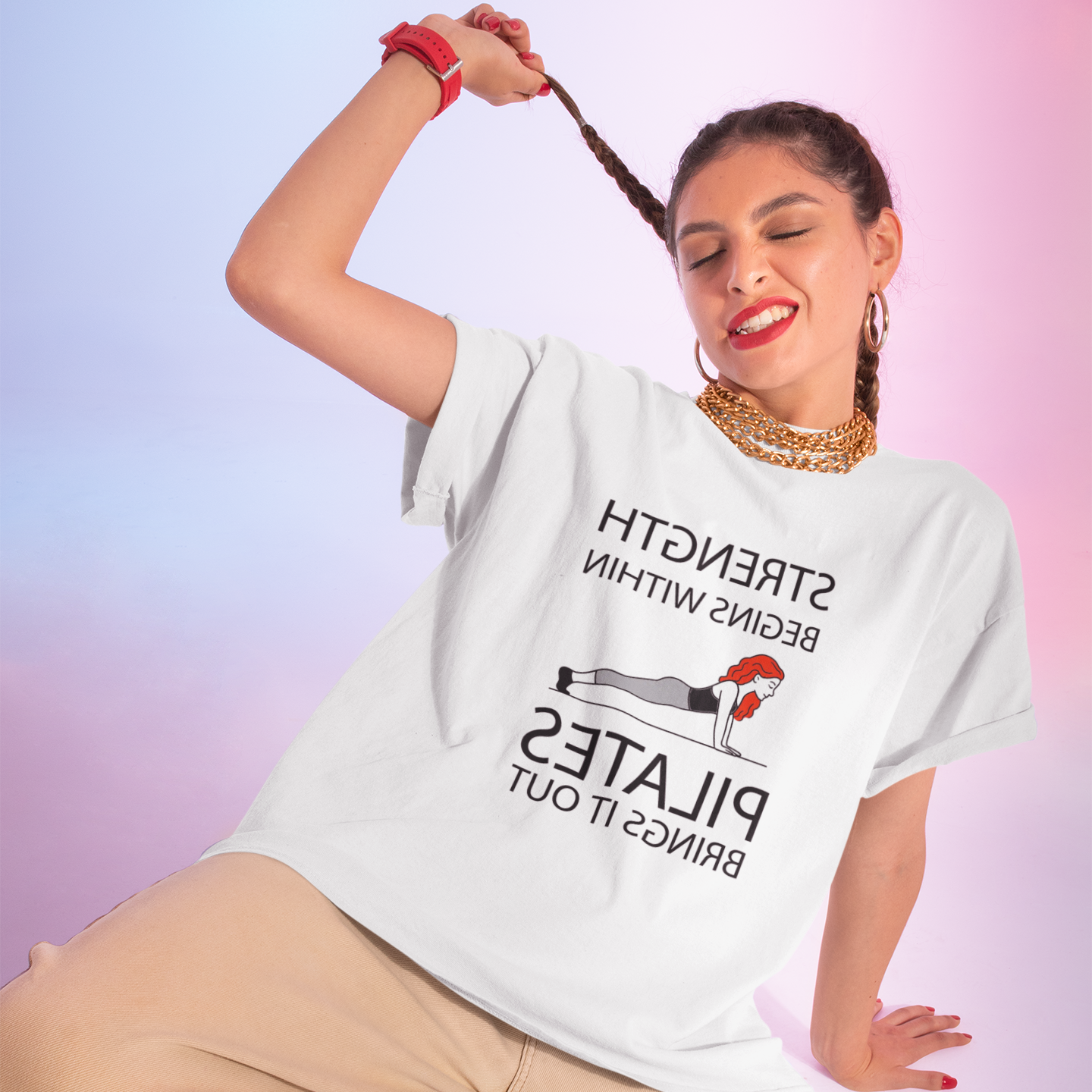 Person wearing a white t-shirt with text and graphics, posing against a gradient background.