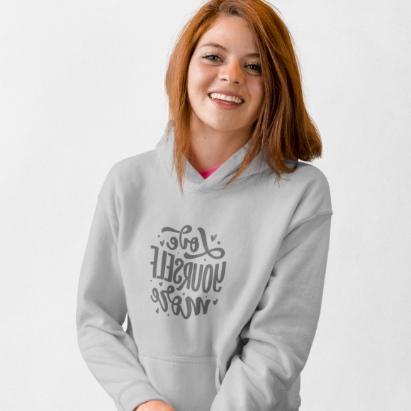 Woman wearing a gray hoodie with text design on a white background